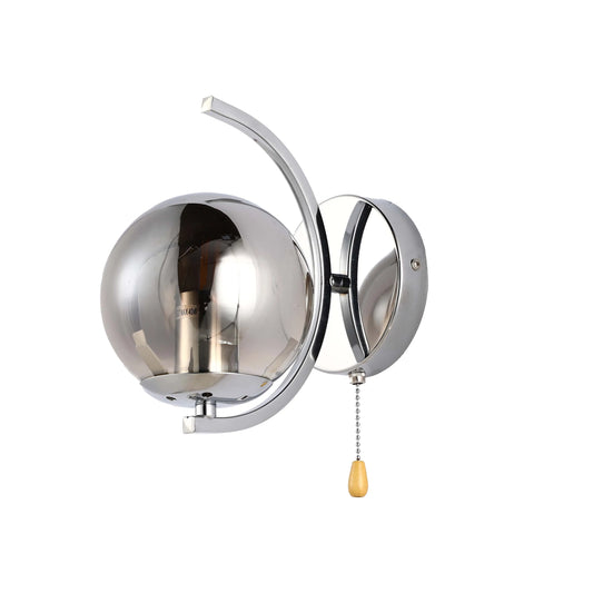 Chrome wall light with smokey glass globe shade and a pull cord. Modern, sleek, and ideal for adding a touch of class to any room.