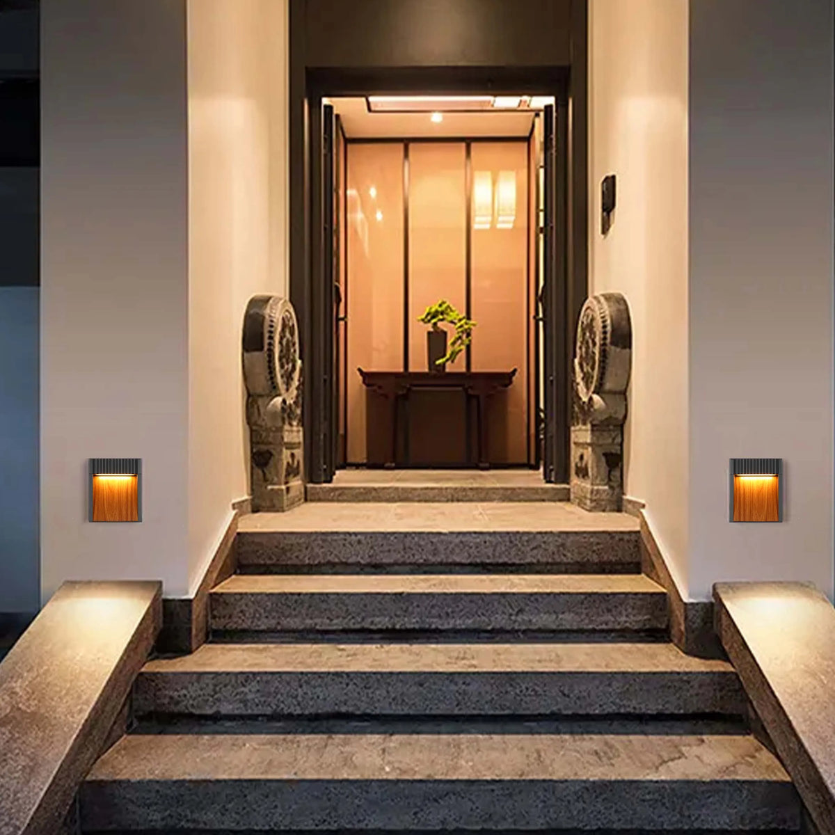Warm lighting illuminates the steps and walls, creating an inviting and elegant entrance ambiance.