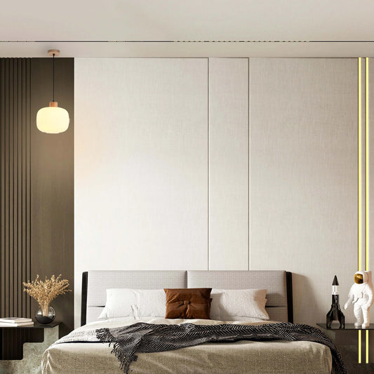 Bedroom with pendant lighting and vertical LED strips. The light provides a warm, ambient glow.