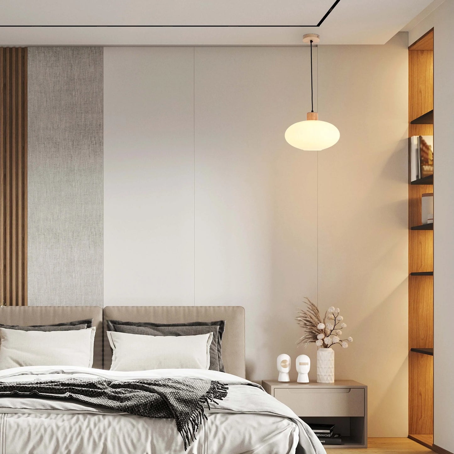A pendant light hangs above a bedroom. The warm glow highlights a sleek, minimalist design, adding a touch of cosiness to the space.