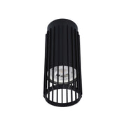 Modern black cylinder downlight with visible bulb. Contemporary design for stylish interior lighting solutions.