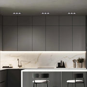 Modern GU10 downlight fixture in a stylish living room, enhancing contemporary decor with its sleek, recessed design.143-03404