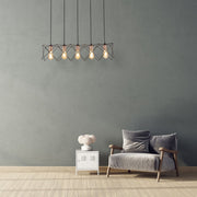 Black metal caged island chandelier with 5xe27 fitting in indoor setting reading room living room