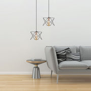 Black metal caged pendant light with e27 fitting in indoor setting living room
