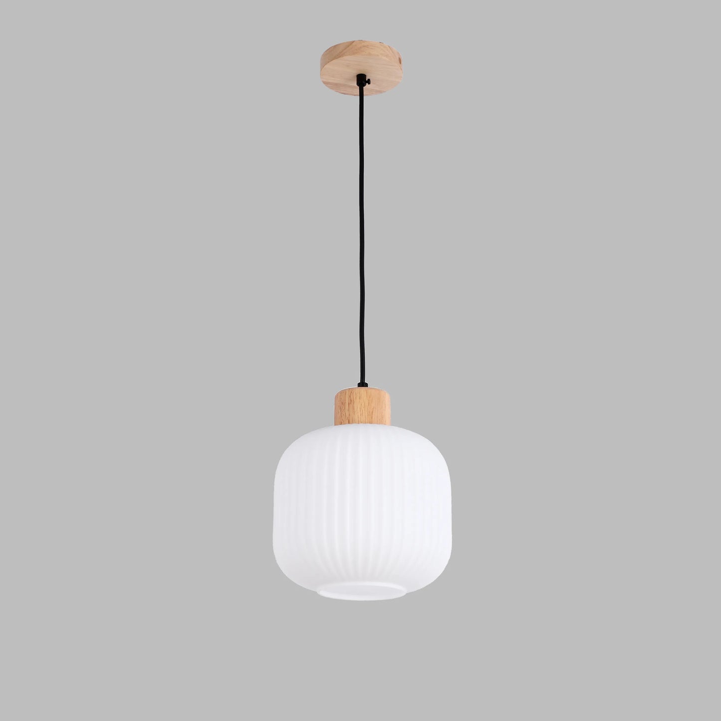 A modern, minimalist pendant light with a ridged white glass shade and wood detailing. A sleek lighting choice.