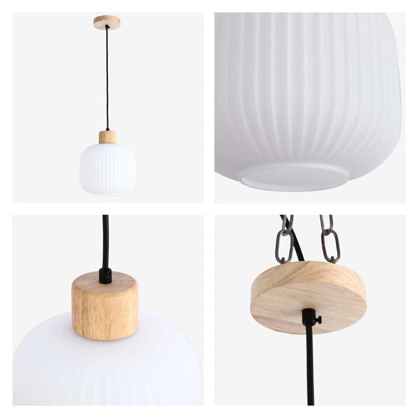 A modern pendant light with a white glass shade and light wood accents.