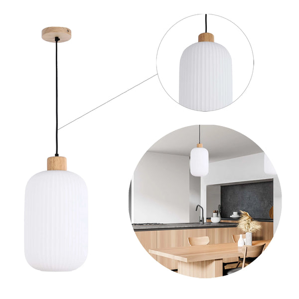 A modern ribbed glass pendant light with a wooden cap suspended by a black cable. In situ over a kitchen table.